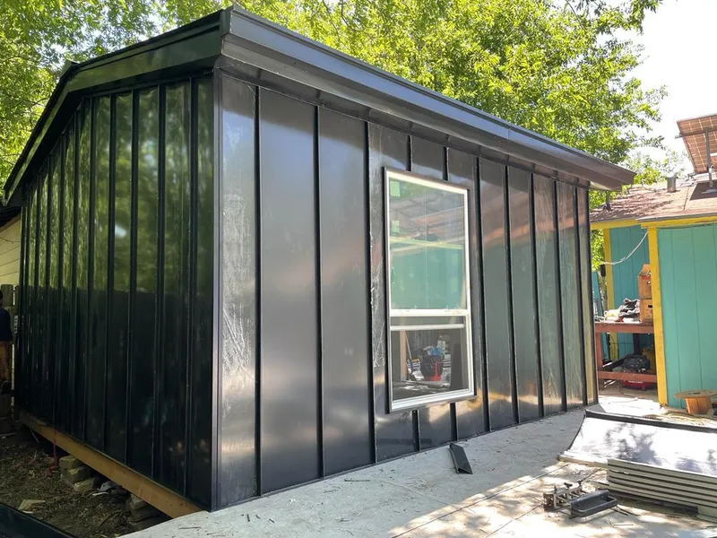 Black standing seam metal wall panels for Roof Inspection in North Bay Village