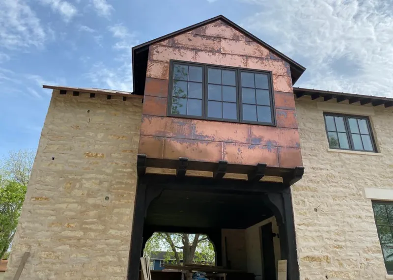 Copper metal panel facade on a stone building for Skylight Installation in North Bay Village